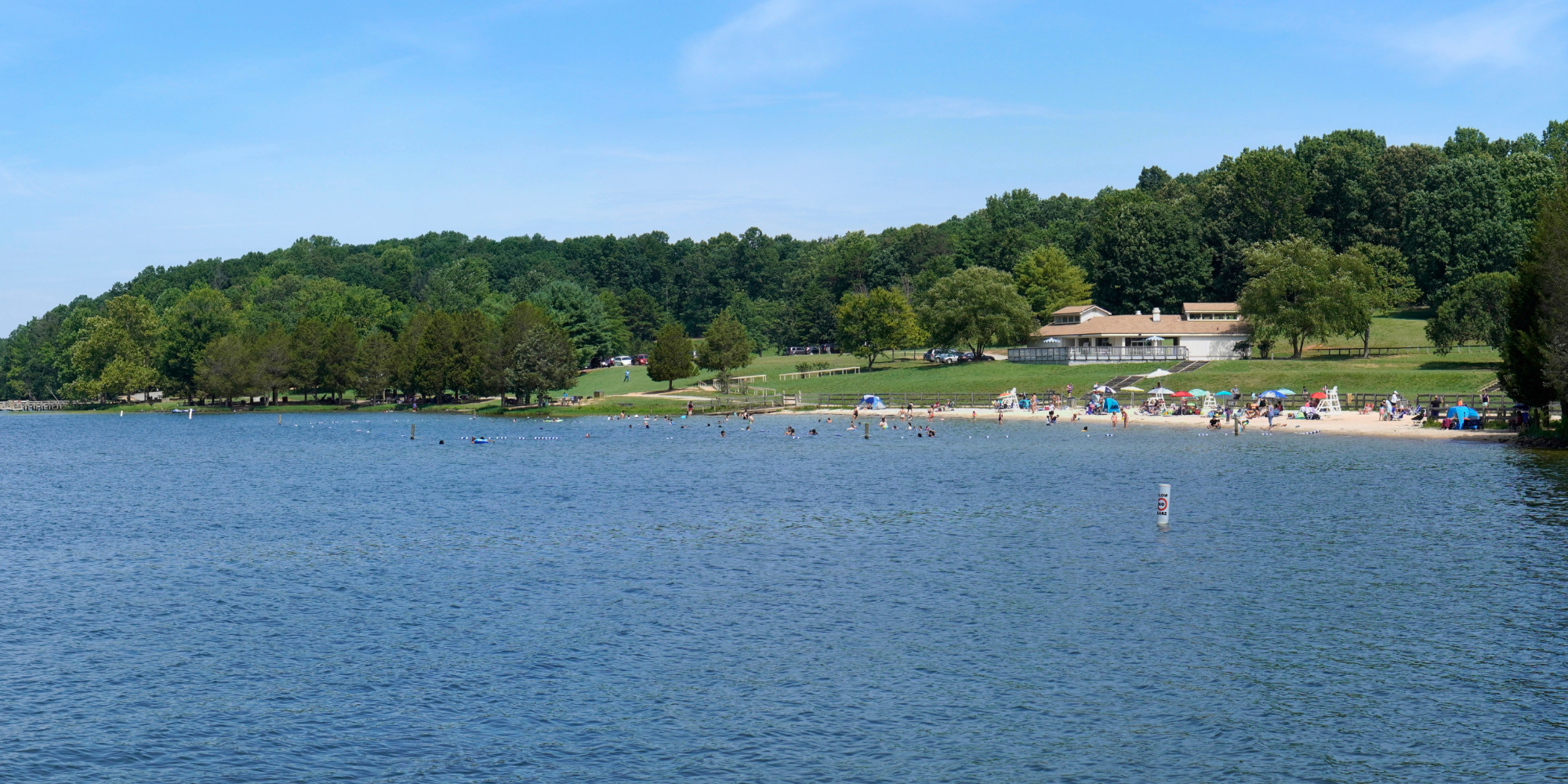 A view of the lake and sandy shore at Lake Anna State Park in Virginia
