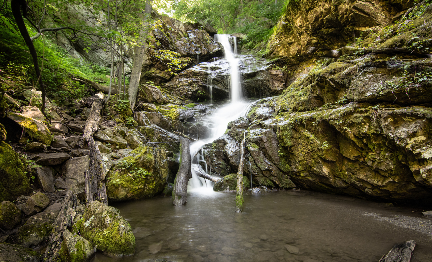 tall waterfall cascading down a rocky cliff in Shenandoah National Park